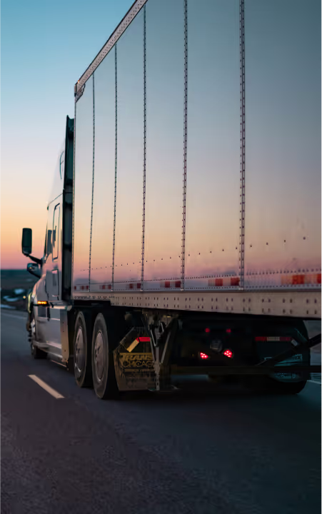 A truck driving down a highway